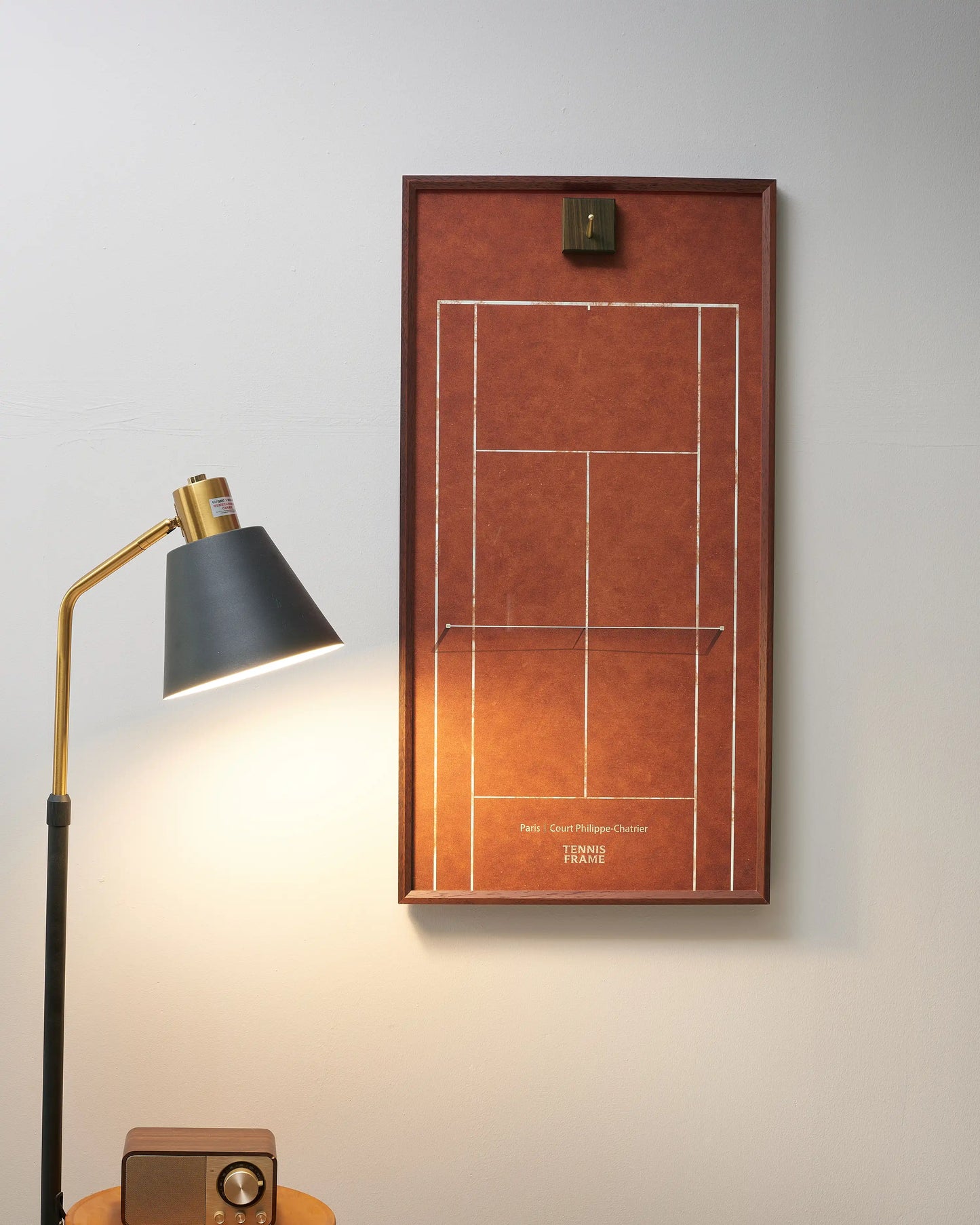 French Open clay court empty racket display frame in walnut wood, minimalist tennis wall art and storage design.