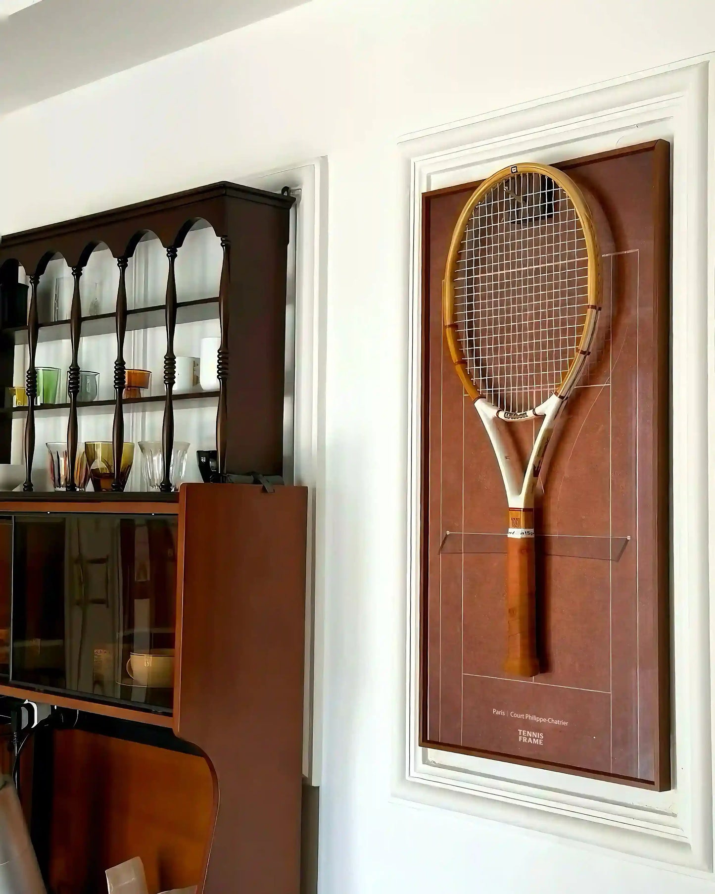French Open Tennis Frame with vintage wooden racket on Court Philippe-Chatrier clay background, mounted on a home interior wall