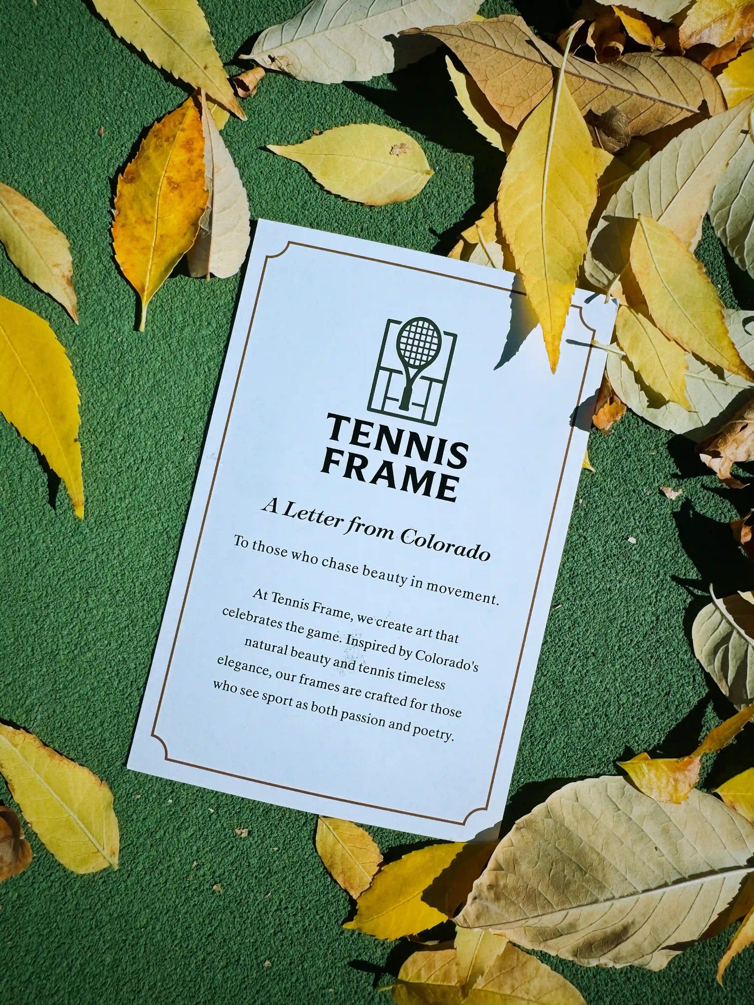 A Letter from Colorado’ front card with Tennis Frame logo on a green tennis court surrounded by autumn leaves.