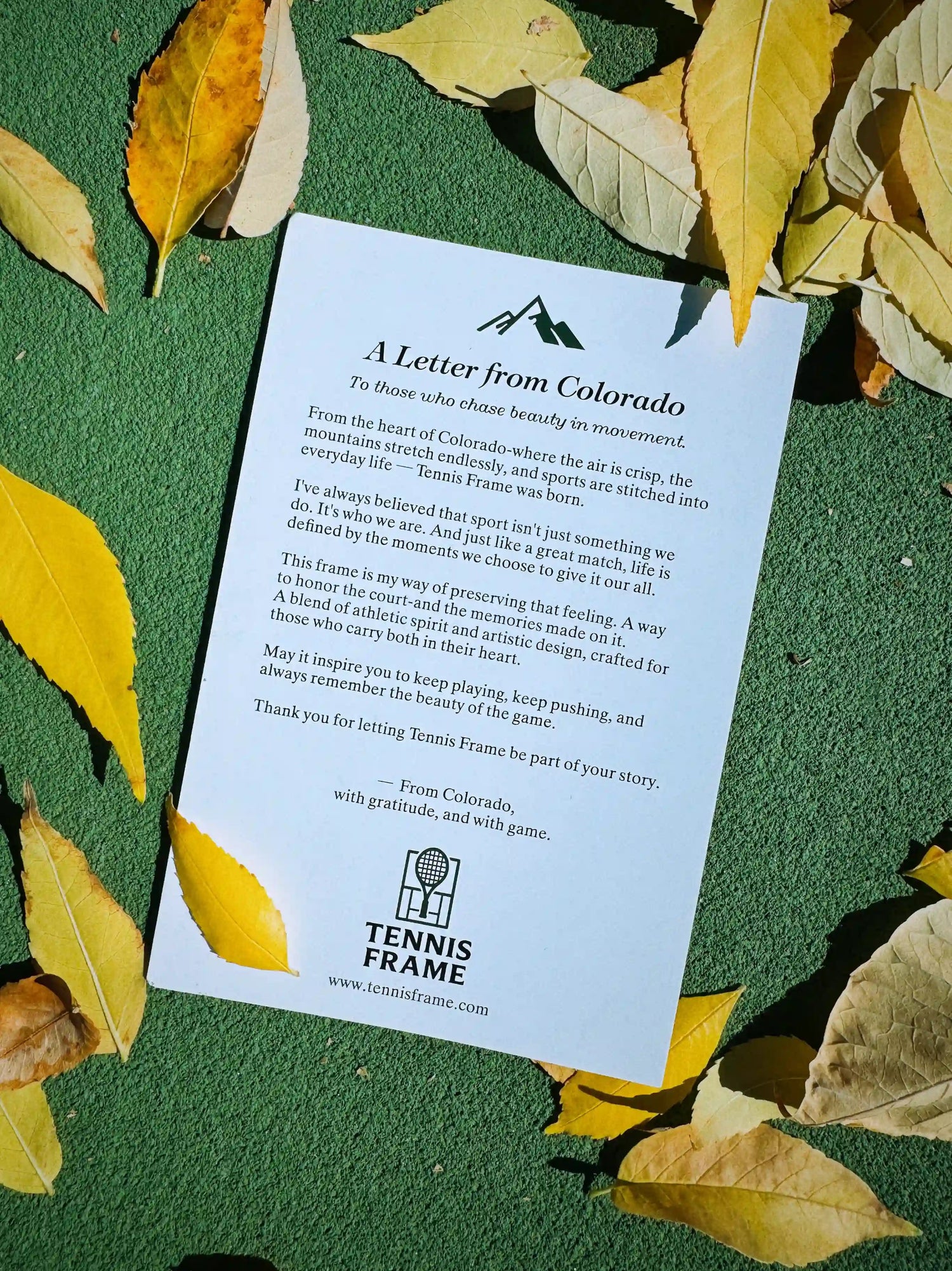 A Letter from Colorado’ back card showing full brand story on a green tennis court with autumn leaves