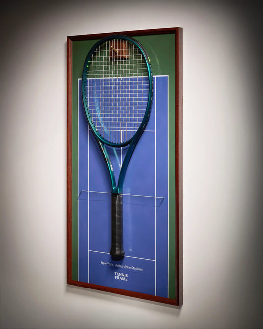 US Open Tennis Frame with green and blue Arthur Ashe Stadium court background, racket wall art photographed from side angle under soft lighting