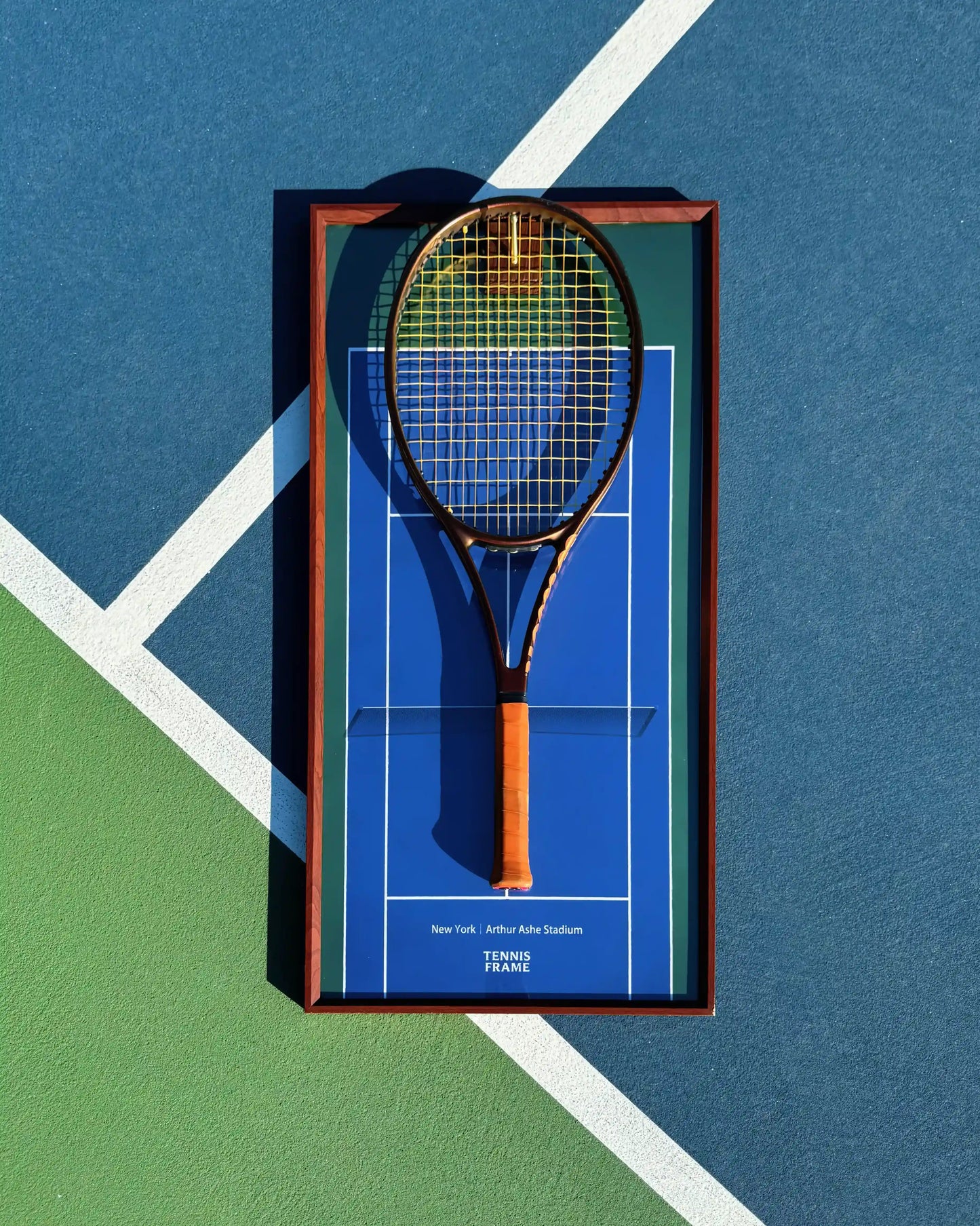 US Open Tennis Frame displaying a Wilson ProStaff racket on Arthur Ashe Stadium blue background, top-down on tennis court