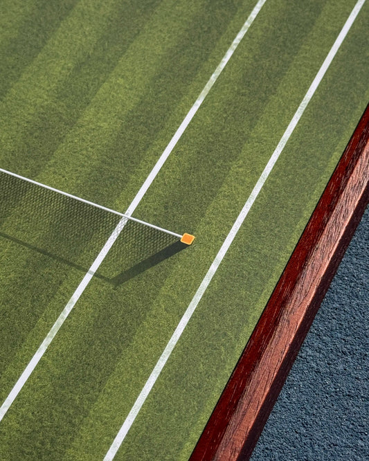 Close-up of Wimbledon grass court lines and net detail on tennis frame, showcasing realistic court design
