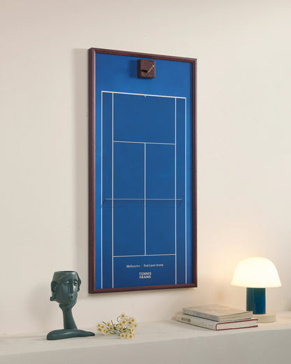 Empty Australian Open blue court tennis frame showing wall-mounted display and racket storage design
