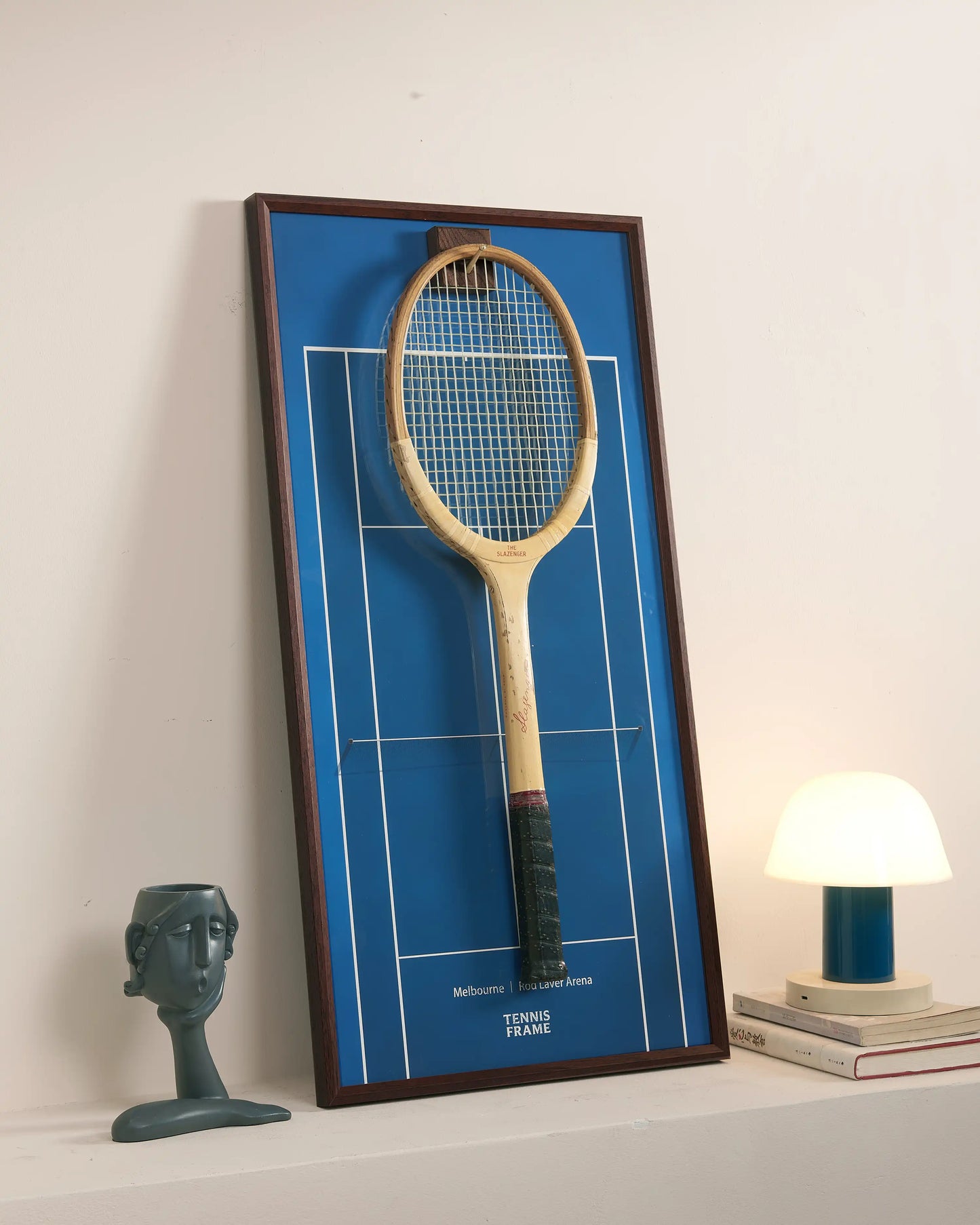 Angled view of Australian Open blue court tennis racket display frame highlighting depth and premium materials