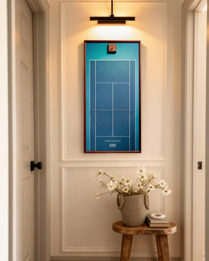 Cincinnati Open Center Court tennis racket display frame with blue hard-court background and walnut frame, styled in a hallway under picture light with flowers