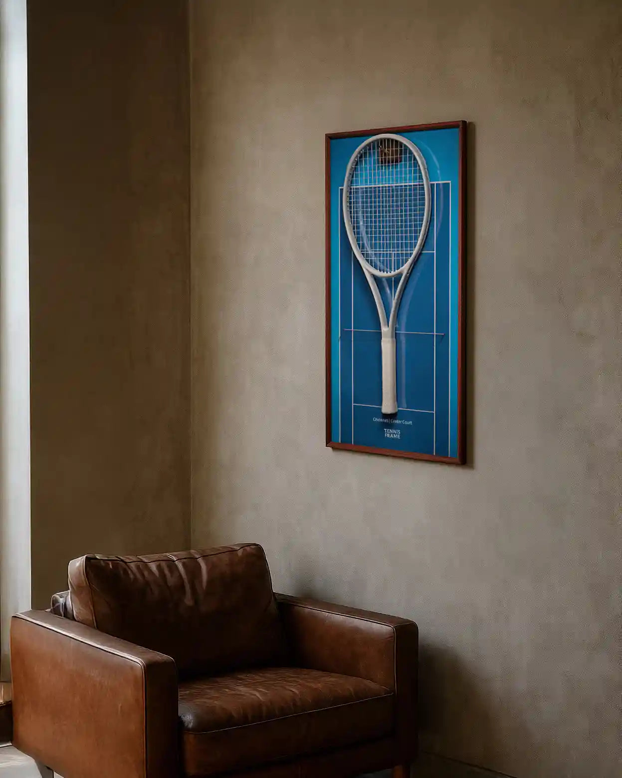 Cincinnati Open Center Court tennis racket display frame with blue hard-court background and walnut frame, styled above a leather chair