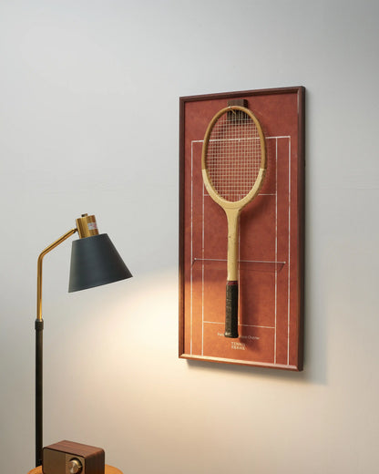 French Open Roland Garros clay court racket display frame in walnut wood, styled on wall with vintage racket and warm lighting