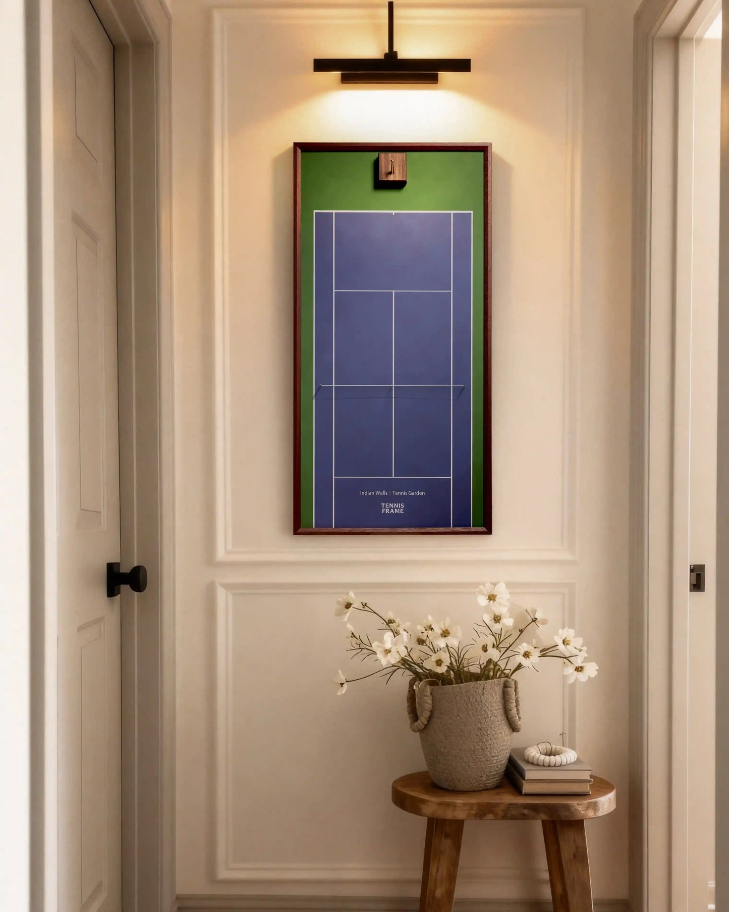 Indian Wells Tennis Garden racket display frame hanging in a hallway—purple-blue court with green border, walnut frame—elegant tennis wall art