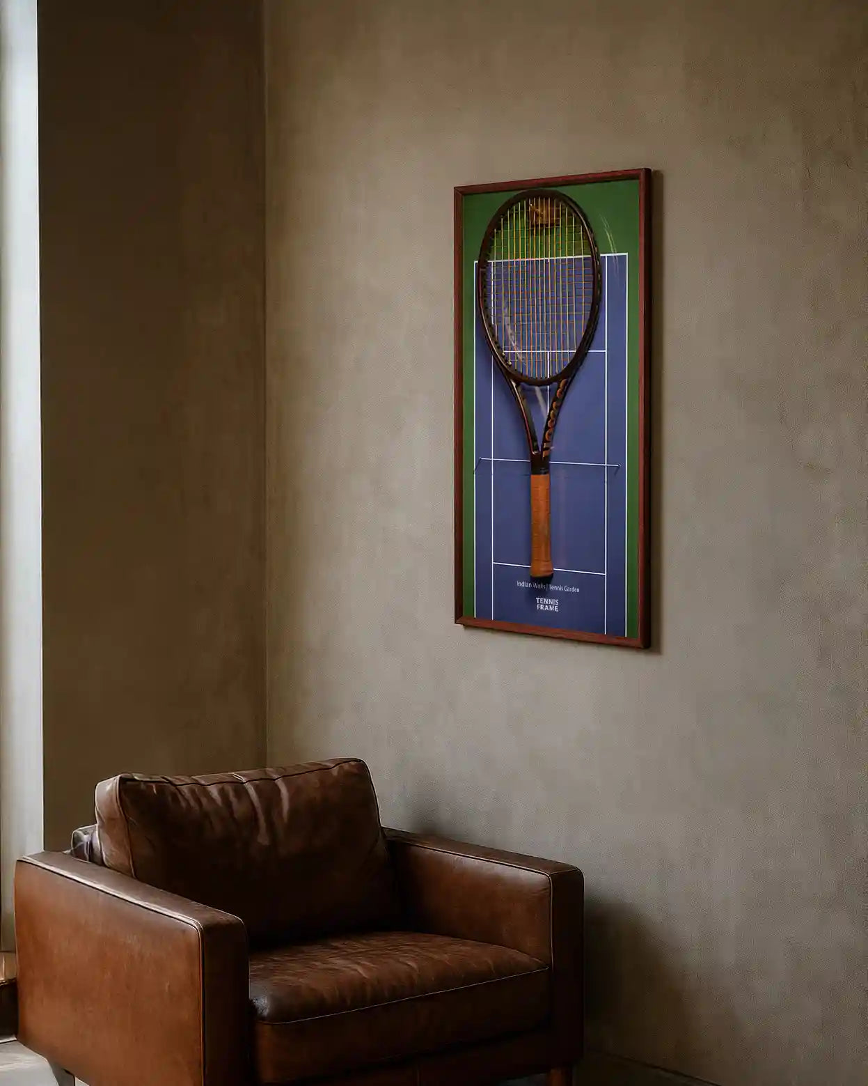 Indian Wells Tennis Garden racket display frame with walnut trim on the Indian Wells Court, styled above a leather chair as premium tennis wall art