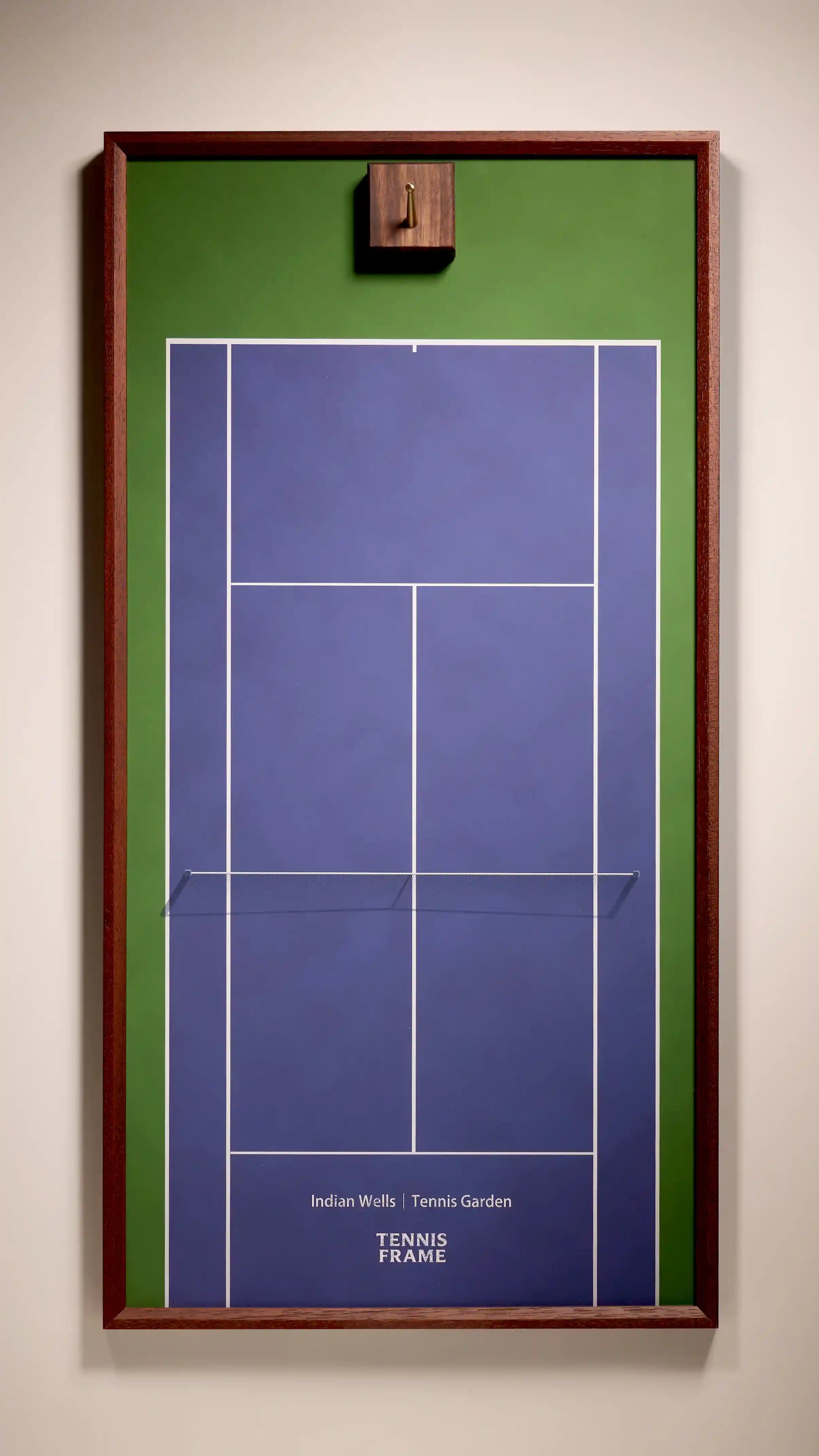 Indian Wells Tennis Garden racket display frame—purple-blue hard court with green border and walnut frame, wall-mounted