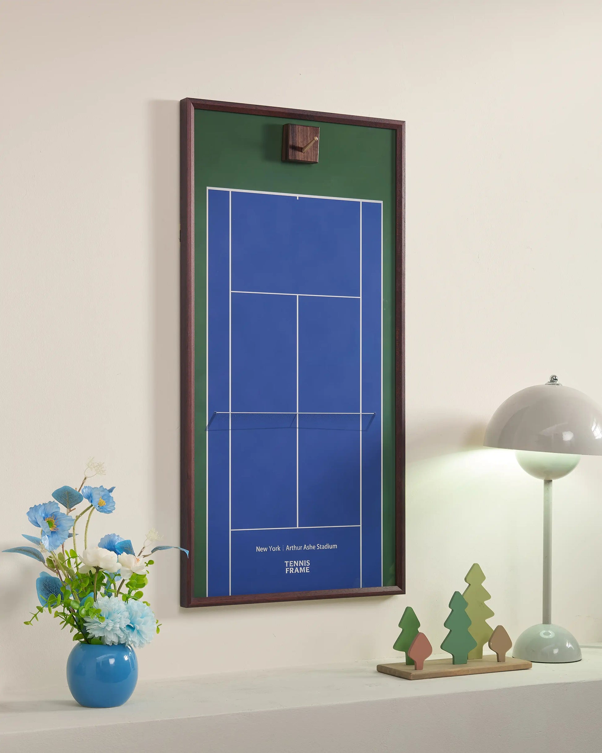 Angled view of US Open inspired blue court tennis frame without racket, showing wall-mounted storage design