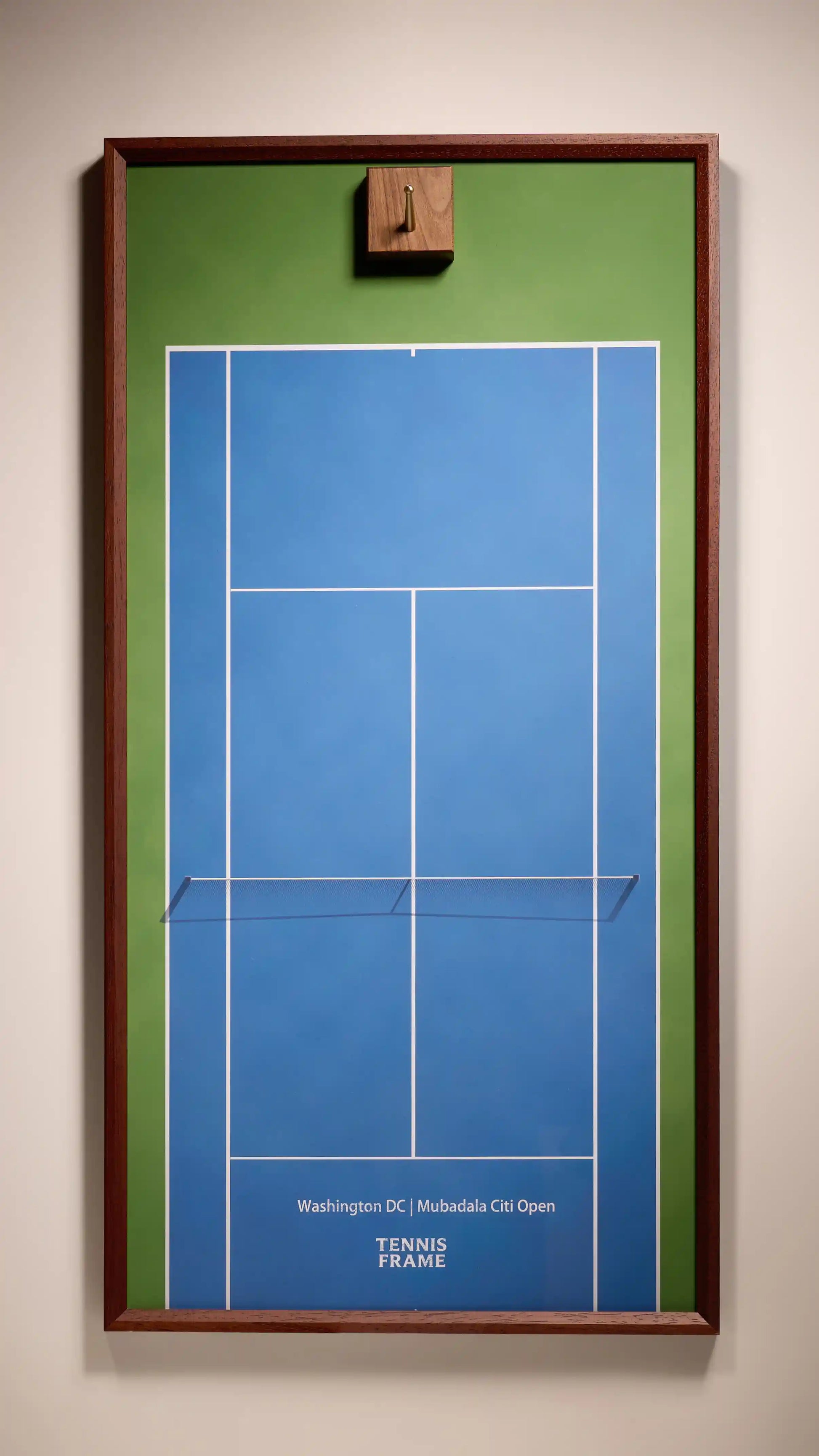 Washington DC Mubadala Citi Open tennis racket display frame with blue hard-court background, green outer lanes, walnut frame and hook, front studio view