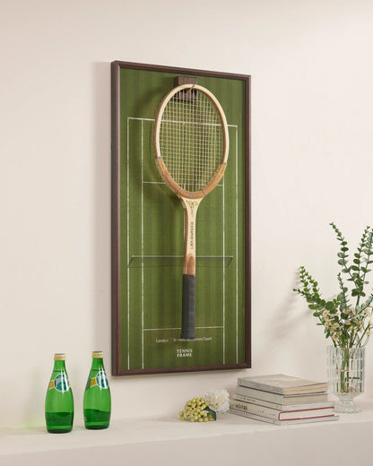 Angled view of Wimbledon-inspired grass court racket display frame, premium tennis wall art with walnut frame