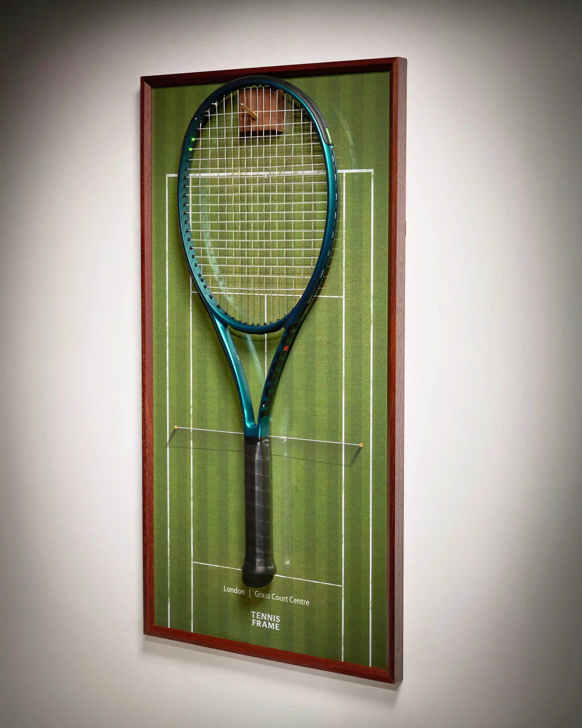 Wimbledon Tennis Frame on grass-court background with walnut hook and hanging racquet, three-quarter angled product view.